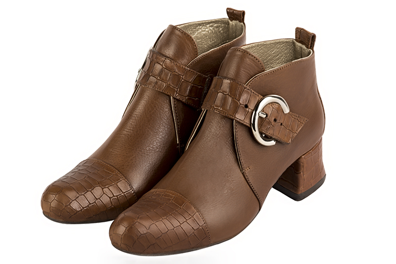 Caramel brown women's ankle boots with buckles at the front. Round toe. Low flare heels. Front view - Florence KOOIJMAN
